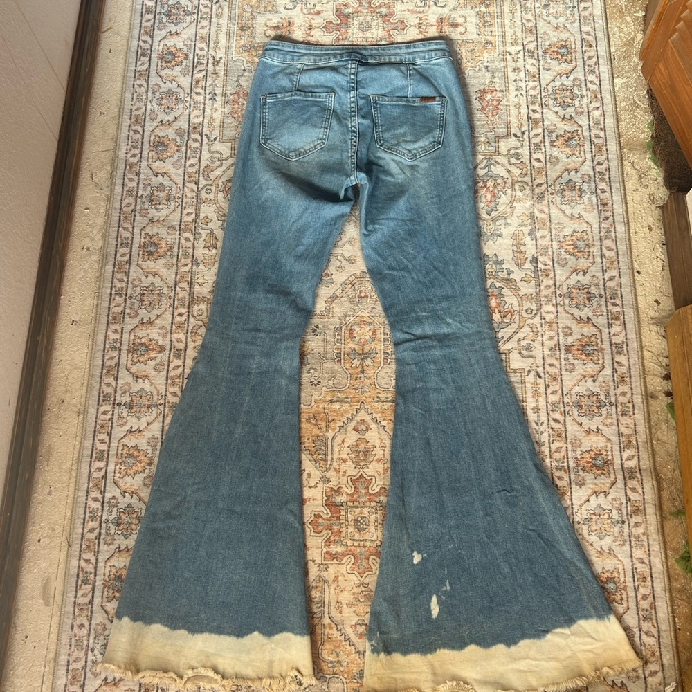 Classic Blue Flare Jeans with Distressed Hem